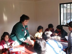 Here I am with my eager students working on coloring sheets about the day's Bible story.